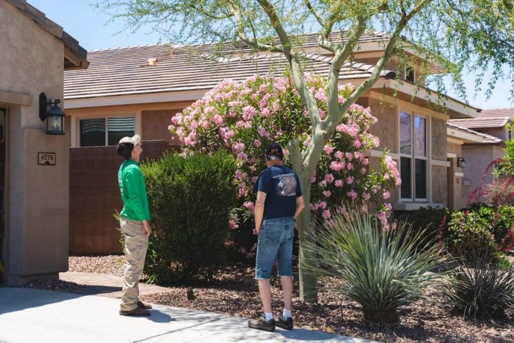 The Yard Experts team member with a client